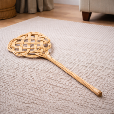 Tapette à tapis en osier